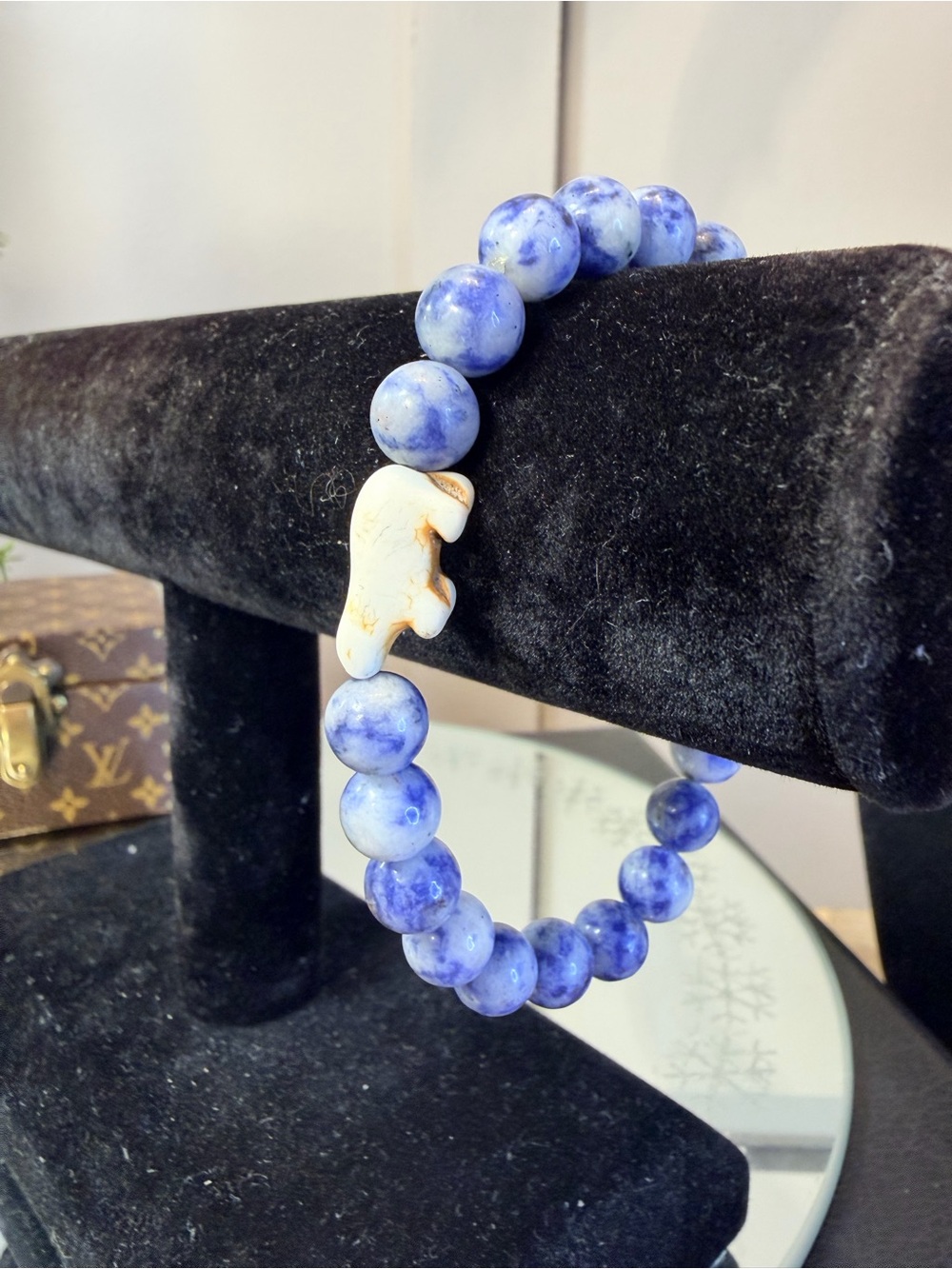 Fahlo Venture Bracelet featuring blue marbled beads and a white polar bear charm